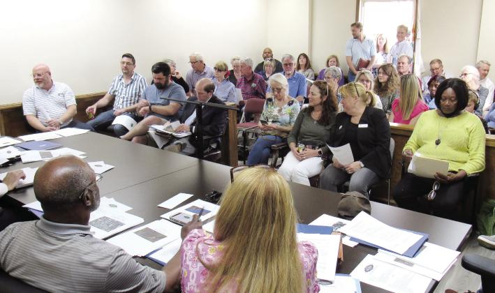 The meeting room used by the Greensboro Planning &amp; Zoning Board was literally standing room only as board members heard arguments regarding a proposed light-industrial development on 364 acres. MARK ENGEL/Staff