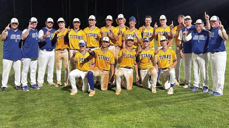 Players and coaches of the 2024 LOA Titans baseball team hold up the No. 1 sign to signify their final standing in Class A Division II Region 8 play this season, a first in the program's history. (CONTRIBUTED)