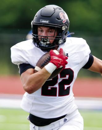 Alex Corrias rushes past defenders during a game against Warren County last season. LANCE MCCURLEY/Staff