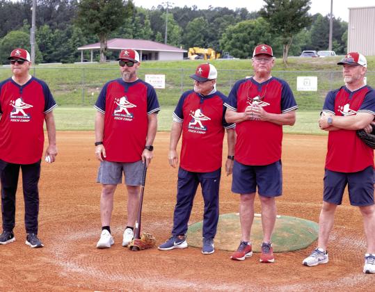 Former Major League Baseball players (l-r) Mike Fischlin, Stephen Drew, Glenn Hubbard, Bruce Benedict and J.D. Drew pose for photos next to Field 3 at the Greene County Recreation Complex during last year’s Fisch Camp. FILE PHOTO