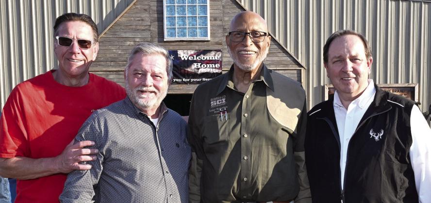 L-R: Chuck Brake of the Lake Oconee Elks Lodge, SCI Director-at-Large and Chapter Vice President James Lakeman, Georgia SCI Chapter President Lester Richardson, and SCI Chief Operating Officer Louie Cole greeted veterans as they entered the Honoring Our Heroes event earlier this month at Briarpatch Farms. CONTRIBUTED