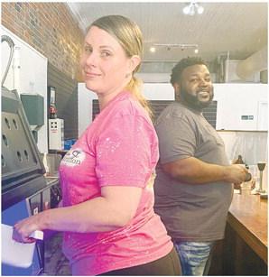 Brandi Price and Sanford Arnold are business partners at Greensboro’s new tea shop. MAUREEN STRATTON/Staff