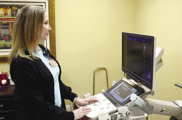 Tracy Askew, a registered diagnostic medical sonographer and registered vascular technologist, performs scans and interprets results from the ultrasound machine. IAN TOCHER/Staff