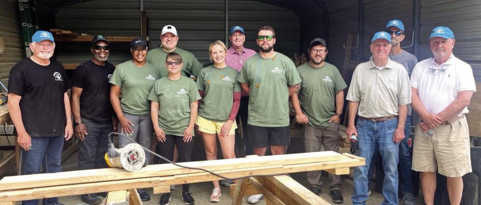 G-P employees help NHN build and deliver kids’ beds. CONTRIBUTED