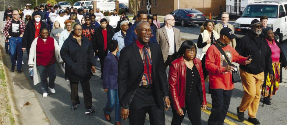 Led by Thedora Sneed (far right), the 2023 Martin Luther King Jr. March departed from the Newlife Outreach Christian Center on Agnes Street in Eatonton.