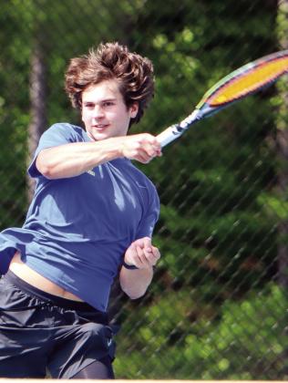 Adam Kalmanowicz hits a forehand return to his opponent during a volley against Wilkinson County last week. (LANCE MCCURLEY/Staff)