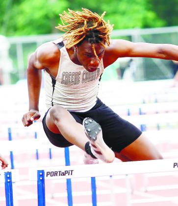 Greene County’s Henry Mitchell glides over a hurdle at the state meet. BRAD HARRISON/Staff