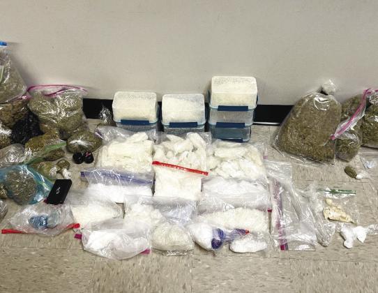 Law enforcement officers from four agencies seized 7 kilograms of methamphetamine and 8 pounds of marijuana following two drug arrests in Athens. CONTRIBUTED