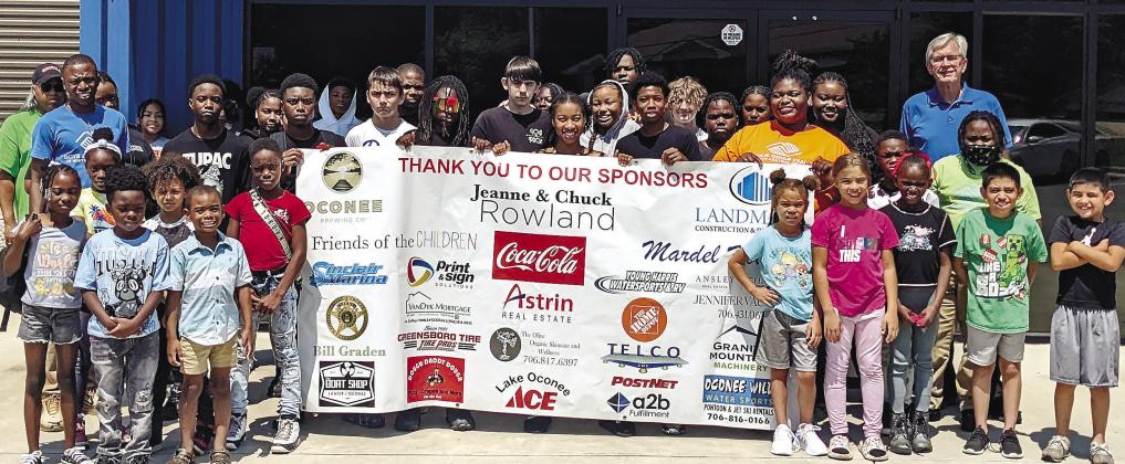 Children attending Pete Nance Boys &amp; Girls Club pose for a group photo thanking sponsors of the BBQ fest. MAUREEN STRATTON/Staff