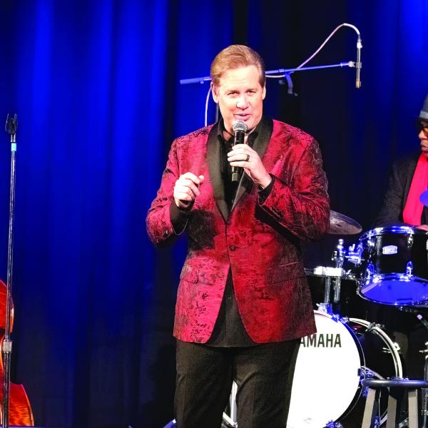 Joe Gransden (center) performs on stage at Greensboro’s Festival Hall. LEIGH LOFGREN/Staff