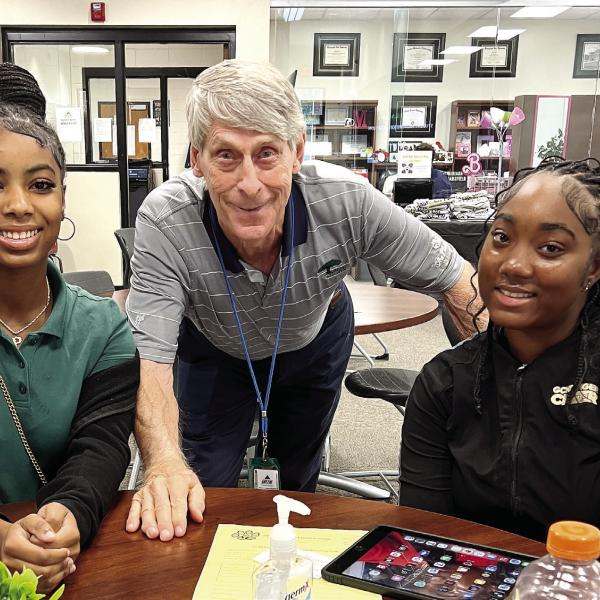 TEF founder Dave Thillen pictured with seniors MaRyah West and Aleyah Redd. CONTRIBUTED