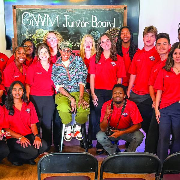 Surrounded by members of Putnam County High School’s Servant Leadership Class, Georgia author Nic Stone (center) relaxes at the Georgia Writers Museum after making a presentation last Friday night about her young adult book, Dear Martin. CONTRIBUTED
