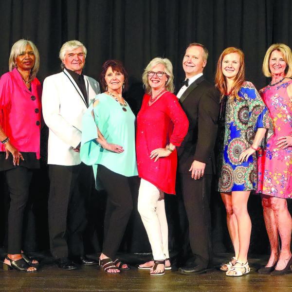 Following the fashion show, models, presenters and organizers gathered on stage from l-r: Ashley Culberson, Lisa Hanscom, Diana Arendt, Juleen DuBois, Josephine Giles, Rick Franks, Suzanne Ramsey, Melinda Spivey, Dr. Jay Spivey, Sarah Spivey, Charlotte Mosteller, Charlotte Engel, Tammy Beatty, Nellie Quiros and Cindy Falanga.