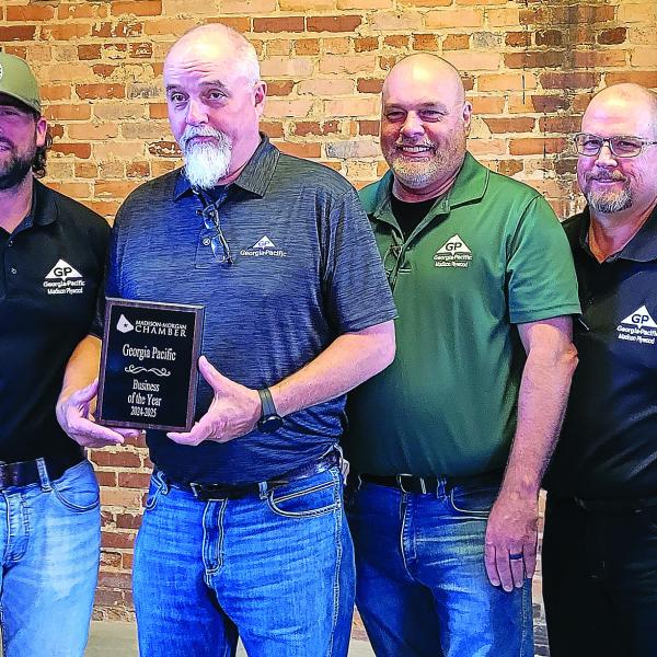 L-R: Georgia Pacific Madison-Plywood employees stand alongside Madison-Morgan Chamber of Commerce President, Shey Daniels, and accept the 2024-2025 Business of the Year award. SKYLA MORRIS/Staff