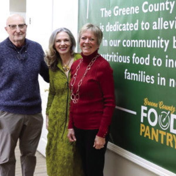 L-R: Steve Ruzika, Nancy DiSpirito, and Becky Smith, GCFP board members, standing in front of the Pantry’s mission statement. CONTRIBUTED