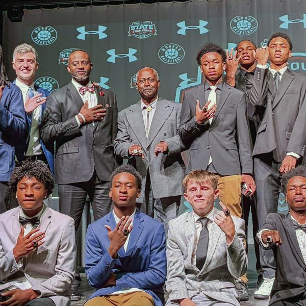 Members of Morgan County’s 2026 GHSA 2 AA championship-winning boys basketball team show off their title rings July 27, during a ceremony in the school’s auditorium. SKYLA MORRIS/Staff