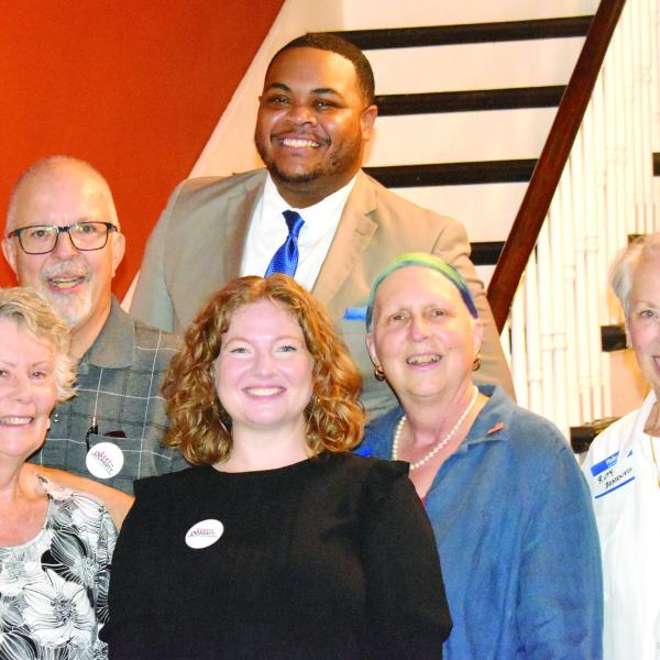 Lexy Doherty, Democratic candidate for the U.S. House of Representatives District 10 seat, visited Morgan County residents at a meet-and-greet in Madison on Aug. 18. She met several members of the Morgan County Democratic Committee. Pictured (bottom row, l-r): Deneice Rice, Doherty, committee chair Jeanne Dufort, and Ruth Bracewell, with (top row) committee secretary Brad Rice and Artez Kelley. (HANNAH BARRON/Staff)