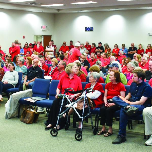 Putnam County Fire Chief Thomas McClain stands beside the podium after he delivered the news that up to 40 citizens attending a Planning &amp; Zoning meeting had to wait outside the large room at the county’s administration building. IAN TOCHER/Staff
