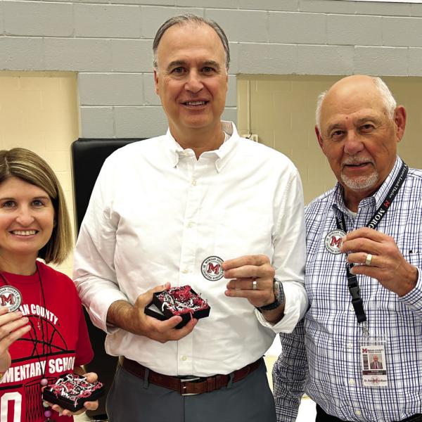 L-R: Chelsea Hayes, Dr. Virgil Cole, and Dr. Dennis Fordham received service coins during Morgan County Charter School’s End-of-Year Celebration for their contributions to the school system. CONTRIBUTED