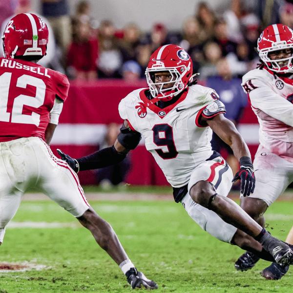Georgia linebacker Chris Cole (9) pressures Alabama quarterback Keelon Russell (12). Cole totaled eight tackles in Tuscaloosa Saturday, along with a sack and two pass deflections. COURTESY OF UGA ATHLETICS