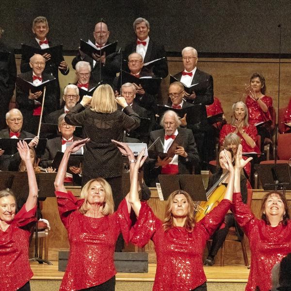 The ladies of the chorus perform a dance choreographed by Maureen Brower and Charlotte Mosteller during “A Tinseltown Christmas.” LEIGH LOFGREN/Staff