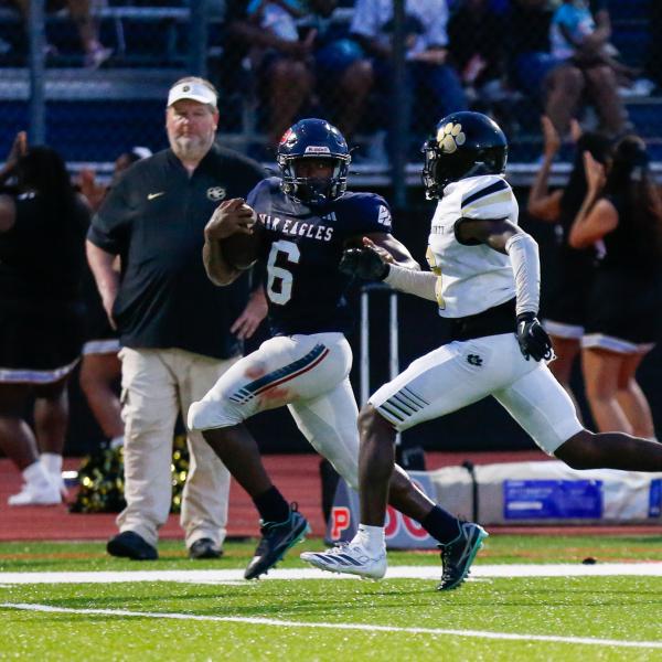 Putnam County senior running back Omarion Butts (6) runs past a Greene County defender on his way to the end zone. LANCE McCURLEY/Staff
