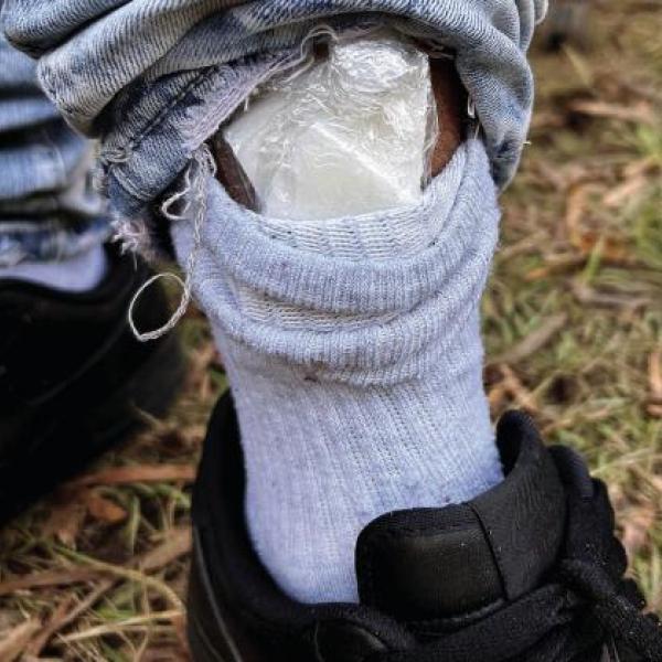 Bagged cocaine is seen in the cuff of Omar Andrews as he was being arrested for an active warrant. CONTRIBUTED/EPD