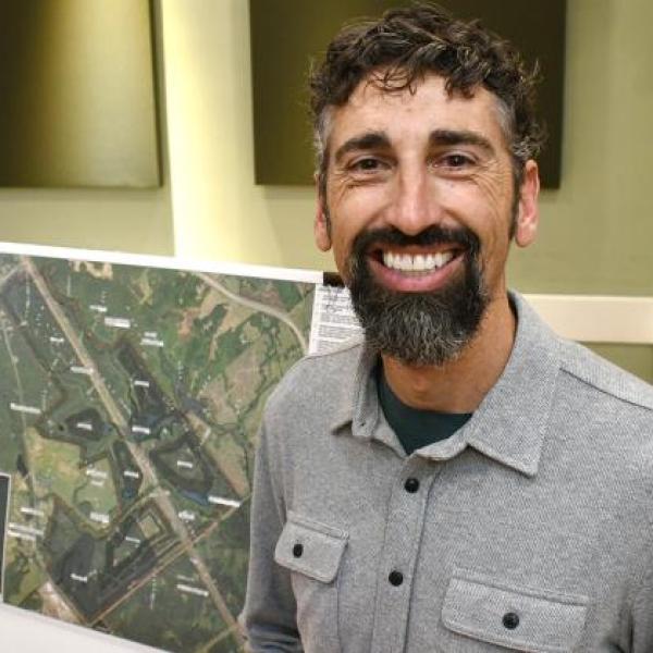 Hans Dawson displays the site plan for the proposed quarry. IAN TOCHER/Staff