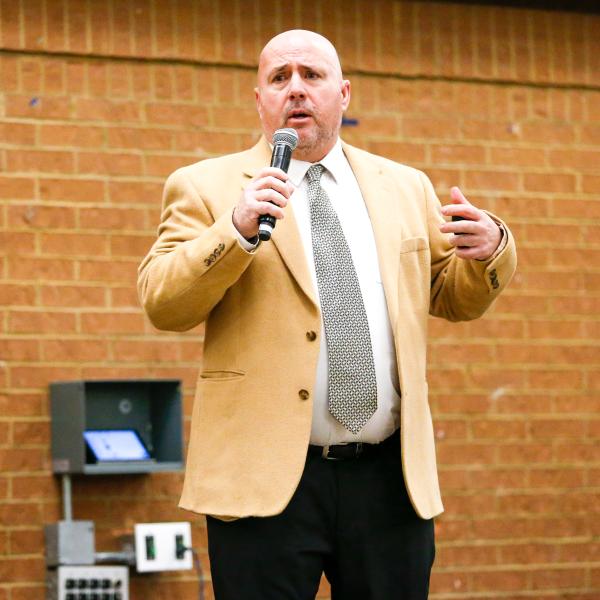 Rome assistant coach Chris MacFarland spoke first, talking to the crowd about various topics, including his head coaching experience and what he would bring to the Greene County program. LANCE MCCURLEY/Staff