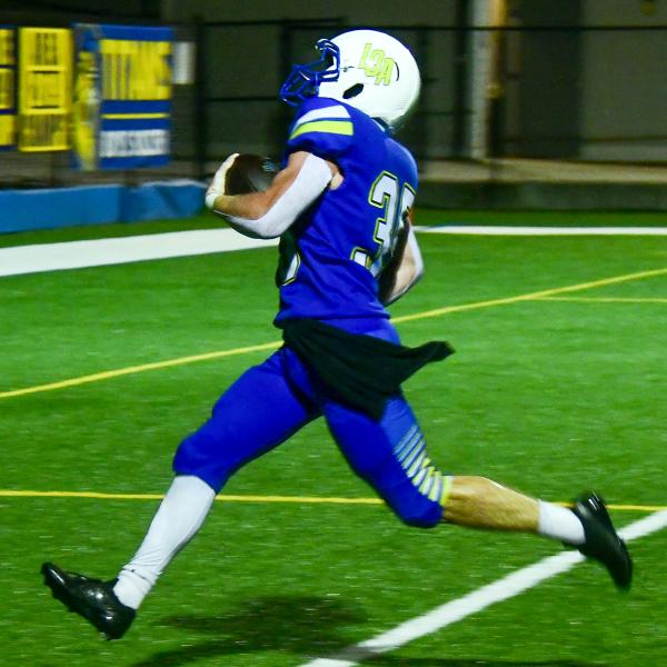 Lake Oconee Academy running back Griffin Stanford races untouched into the end zone for one of his four touchdowns against Mount Pisgah. IAN TOCHER/Staff