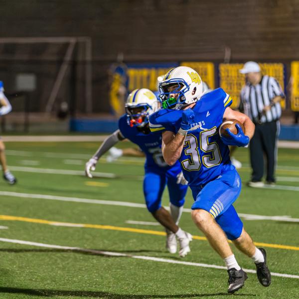 Titans senior running back Griffin Stanford runs on a kick return against the War Eagles. SKYLA MORRIS/Staff