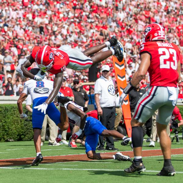 Georgia Tight End Elyiss Williams (10) dives for the pylon over a Tennessee State defender