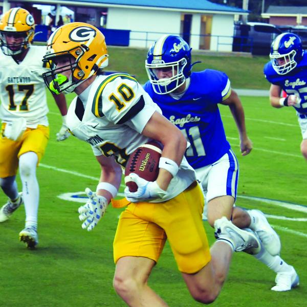 Gatewood quarterback Blake Brannen (10) rushes past Brentwood defenders in last Friday night's loss to the War Eagles. IAN TOCHER/Staff