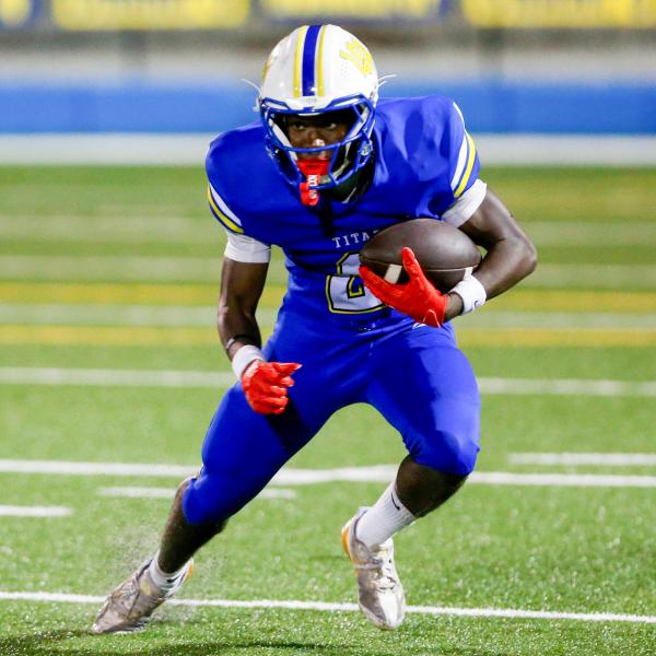 Lake Oconee Academy running back Marcus Rhodes carries the ball during a scrimmage in August. LANCE MCCURLEY/Staff