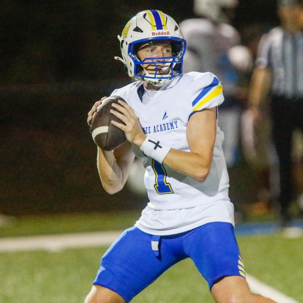Lake Oconee Academy junior quarterback Jake McDonald drops back to pass during a scrimmage against The Walker School on Aug. 7. McDonald completed 8 of 10 passes for 92 yards and rushed for a 1-yard touchdown in the Titans’ win over Greenville last Friday. LANCE MCCURLEY/Staff