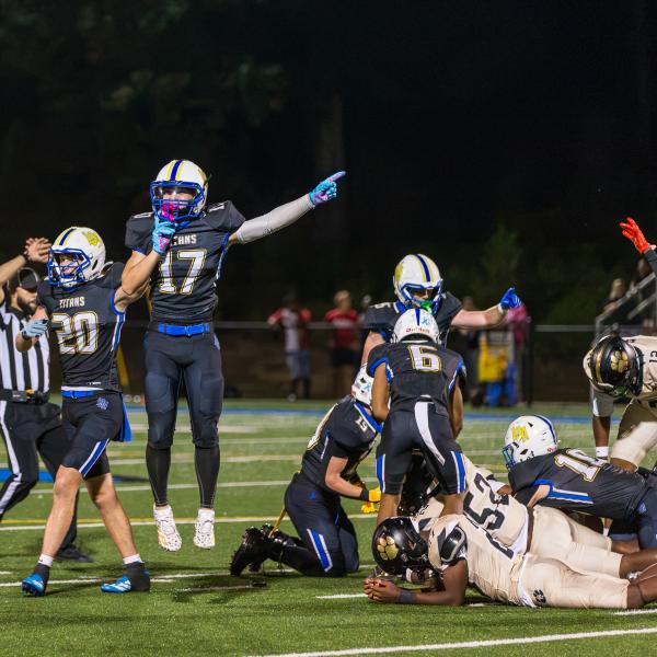 Luis Rodriguez (17), and Jon Funderburke (20) celebrate and signal a fumble recovery during the second quarter of last week’s game. SKYLA MORRIS/Staff