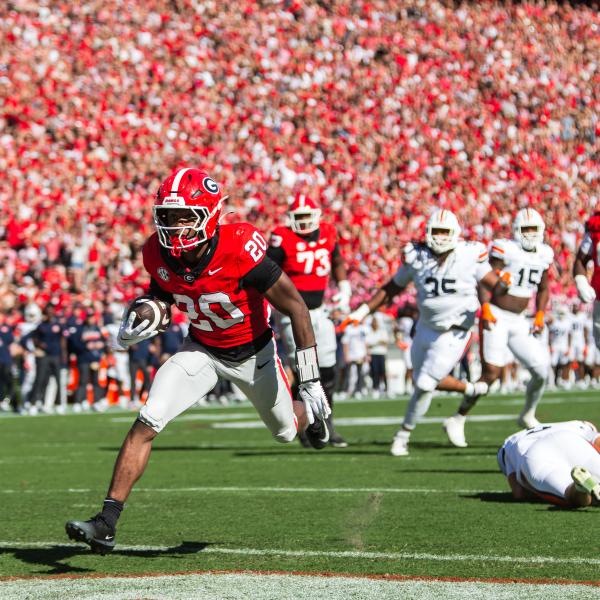 Georgia running back Dwight Phillips Jr. sprints into the end zone for a 7-0 lead against Auburn. SKYLA MORRIS/Staff