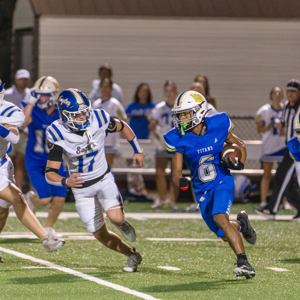 Titans senior running back Kam Geter attempts a kick return in a game earlier in the season. SKYLA MORRIS/Staff