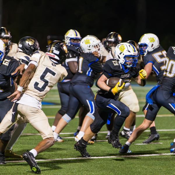 LOA junior running back Alden Barreras (19) breaks through a tackle against Greene County earlier in the season. SKYLA MORRIS/Staff