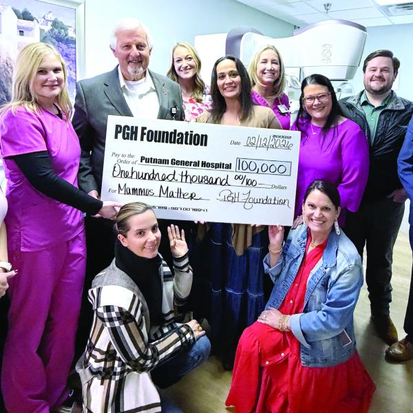 Putnam General Hospital leaders and staff pose earlier this month with a sizable contribution from the PGH Foundation on behalf of local donors. SKYLA MORRIS/Staff