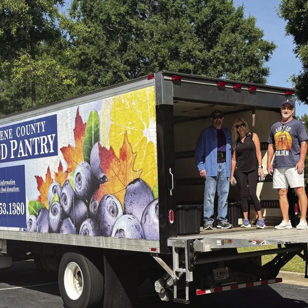 L-R: Greene County Food Pantry Chairman Steve Ruzika, Michelle Perry, and Rick Perry took part in organizing item donations during the Tuesday morning event. CONTRIBUTED
