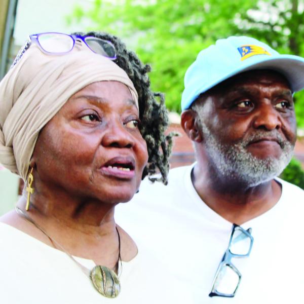 Greene County African American Museum founder and historian Mamie Hillman and her husband, John Hillman Sr., listen to one of the speakers before the marker is unveiled. LYNN HOBBS/Staff