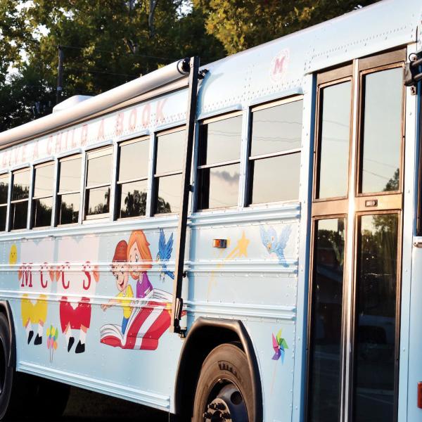 The Morgan County Board of Education unveils its literacy bus, themed around “If You Give a Child a Book.” (HANNAH BARRON/Staff)