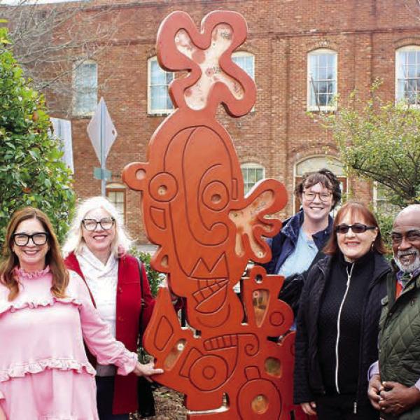 The “All These Mixed Emotions” sculpture is unveiled in Madison’s Town Park by city staff and members of Madison’s Public Arts Commission (PAC), including (l-r) Jill Reale, staff; Emmie Smock, PAC; Sherri-Aynn Collins, PAC; Jennifer King Lockridge, PAC; Mollie Bogle, staff; Emily Smeltzer, PAC; Vic Jackson, PAC; and Sarah Wibell, staff. CONTRIBUTED