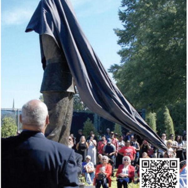 Marshall Little watches as the statue of his father, Hiram Little, is finally revealed before an appreciative crowd in downtown Eatonton.