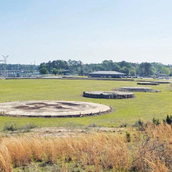 All that’s left of the once-mighty, 1,007-feet-tall smokestack that towered over Plant Branch is a circular concrete base in an open field. Built in 1978, the smokestack was dropped in a controlled demolition on Oct. 15, 2016. COURTESY GEORGIA POWER