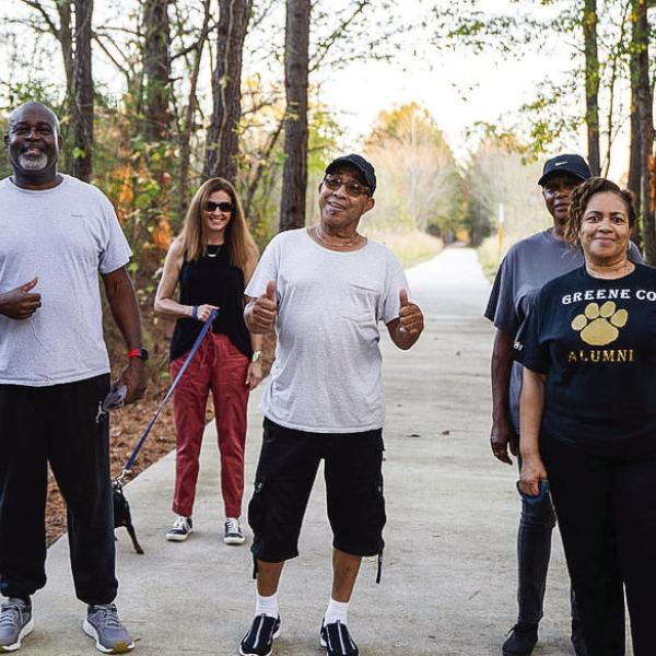 A group of pedestrians enjoys a walk on the Firefly Trail. CONTRIBUTED