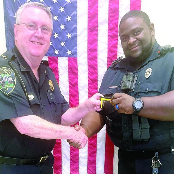 Interim Chief Roy Whitehead and Police Officer Jonathan Mills who was recently promoted to senior police officer. CONTRIBUTED