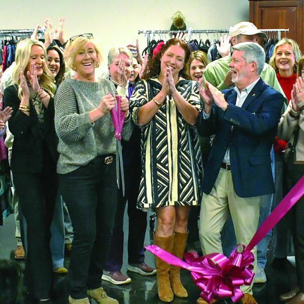 Well-wishers cheer as the ribbon falls to officially open Second Chance Boutique at 939 Greensboro Rd., Eatonton. Proceeds from the upscale thrift store will benefit Circle of Love, a long-running domestic violence shelter in Greene County. IAN TOCHER/Staff