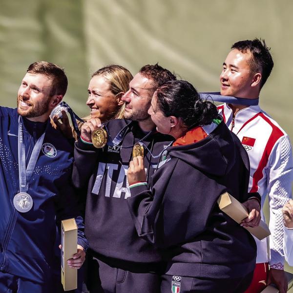 Former Eatonton resident Vincent Hancock (left) takes a selfie on the Olympic podium in France alongside his silver medalist partner Austen Smith (second from left) and the gold and bronze medal-winning pairs from Italy and China, respectively, in mixed team skeet shooting. Courtesy USA Shooting
